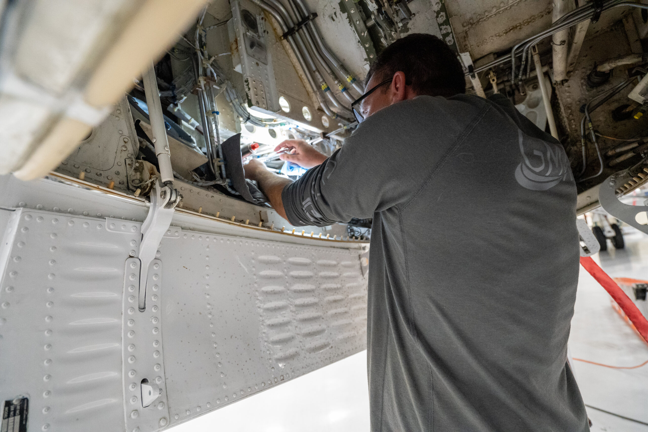 jet mechanic performing repairs