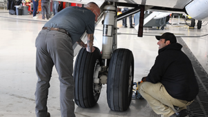 Mechanics inspecting custom PPI