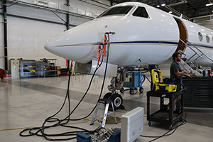 Airframe receiving pre-purchase inspection in hangar