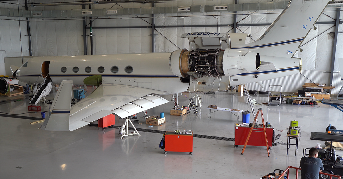 private jet airframe in hangar receiving pre-purchase inspection of logbook review and engine inspection